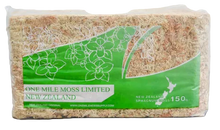 Load image into Gallery viewer, Packaged moss from One Mile Moss Limited, New Zealand on a wooden surface.